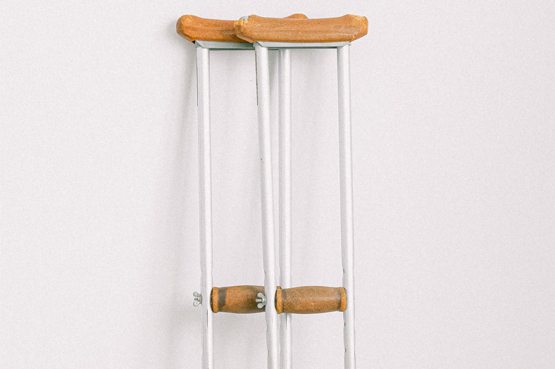 Crutches leaning against wall